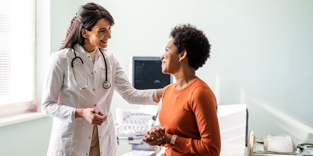 a doctor talks to her patient